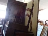 a room with a lot of furniture and a surfboard in it