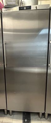 three stainless steel refrigerators in a kitchen next to each other