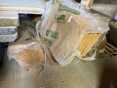 a pile of boxes sitting on the floor in a room