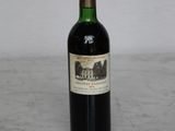 a bottle of wine that is sitting on a table