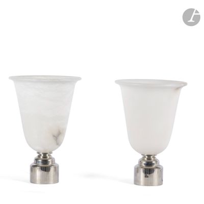 pair of white glass vases with silver bases on a white background