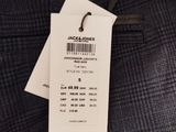the label on the jacket is attached to the tag of the jacket