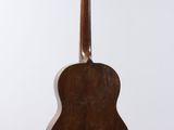 a close up of an acoustic guitar on a white background