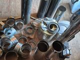 many different types of pipes on the floor