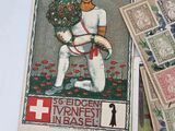 a picture of a man holding a bunch of stamps