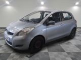 a picture of a silver toyota yaris parked in a garage