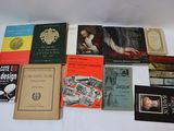a lot of books that are on a white table