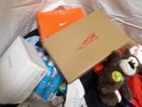 a teddy bear that is sitting in a box