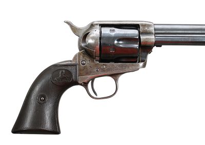 an old gun with a wooden handle on a white background