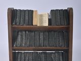 a book shelf with books on it and a book on it
