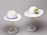 two hats that are sitting on top of a table