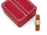 a red box with a watch on it and a red box with a watch on it