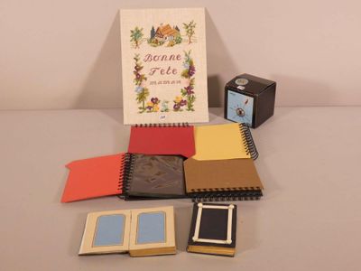 a picture of a book, a notepad, a clock, and a notepad on a table