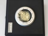 a clock that is on the wall in the room
