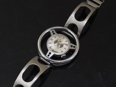 an image of a wrist watch on a black surface