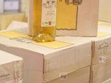 several boxes of wine are stacked on top of each other on a table
