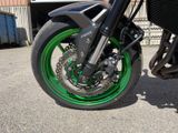 a close up of a motorcycle tire with green rims