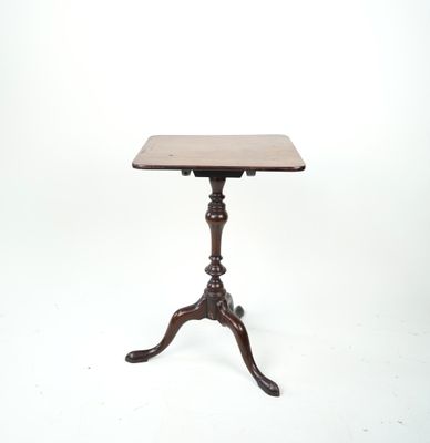 an image of a small table with a wooden top on a white background