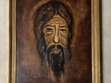 une peinture représentant un homme barbu accrochée au mur