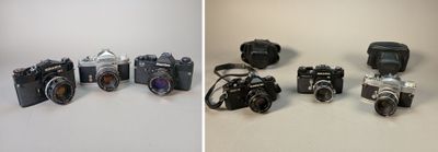 many different types of cameras sitting on a table