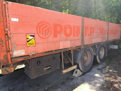a red truck that is parked on the side of the road