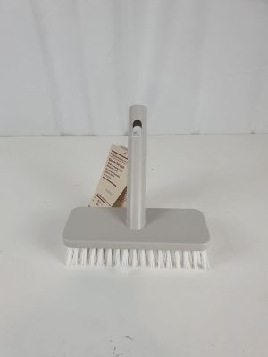 a close up of a brush with a tag on it
