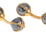paire de boutons de manchette en or et en verre noir, ornés d'une cordelette
