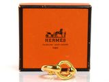 an image of a gold ring with a horse ' s head on it