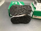 a pair of shoes sitting on a table next to a box