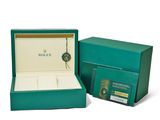 a close up of a box with a watch inside of it