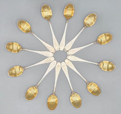 a lot of spoons arranged in a circle on a table