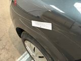 a black car with a sticker on the side of it
