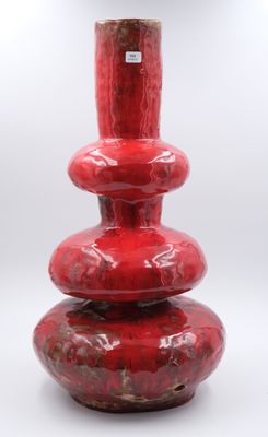 Pied de lampe en céramique à glaçure rouge.