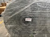 several rolls of wire wrapped in plastic sitting on top of a pallet