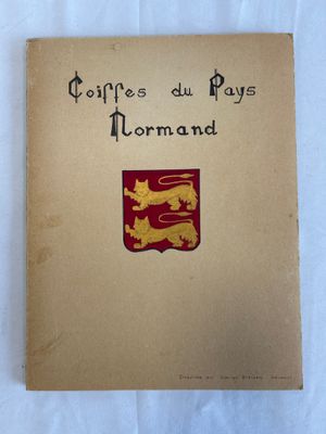 an old book with a coat of arms and a lion on it