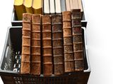 a basket full of old books sitting on a table