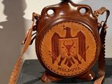 a wooden vase with a picture of an eagle on it