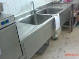 a kitchen with a sink and a dishwasher in it