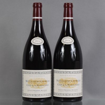 two bottles of wine sitting on top of a table next to each other