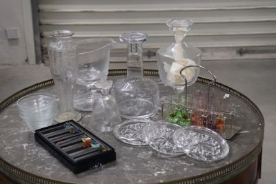 a table that has a lot of glass items on it