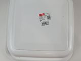 a plastic container with a lid that has a sticker on it