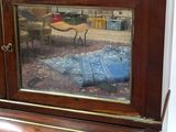 a reflection of a person in a mirror on a desk
