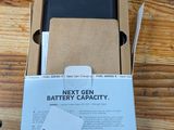 a box with a phone inside of it on a table