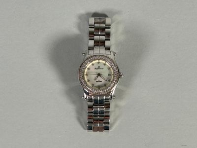 an image of a woman ' s wrist watch with a diamond bezel
