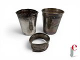 two silver cups with a silver band and a silver ring