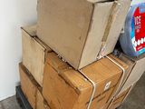 many boxes stacked on top of each other in a room