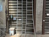 a large metal rack in front of a garage door