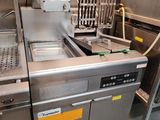 an image of a commercial kitchen with stainless steel appliances