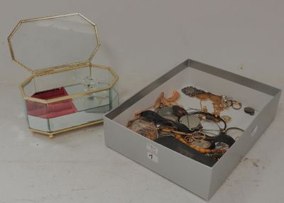 a box with a mirror and a pair of scissors in it