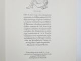 an open book with a drawing of a cat on it